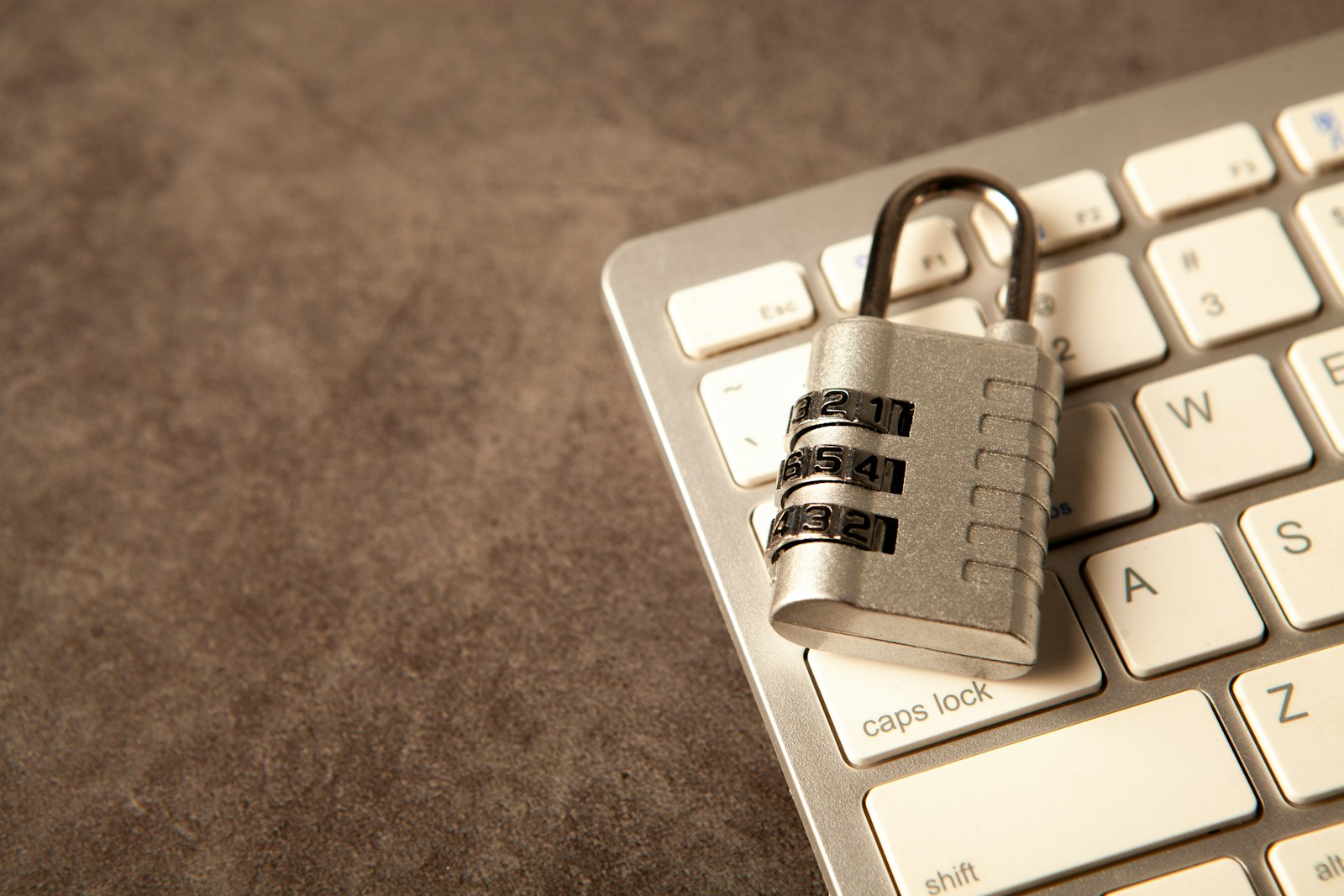 Padlock resting on a computer keyboard